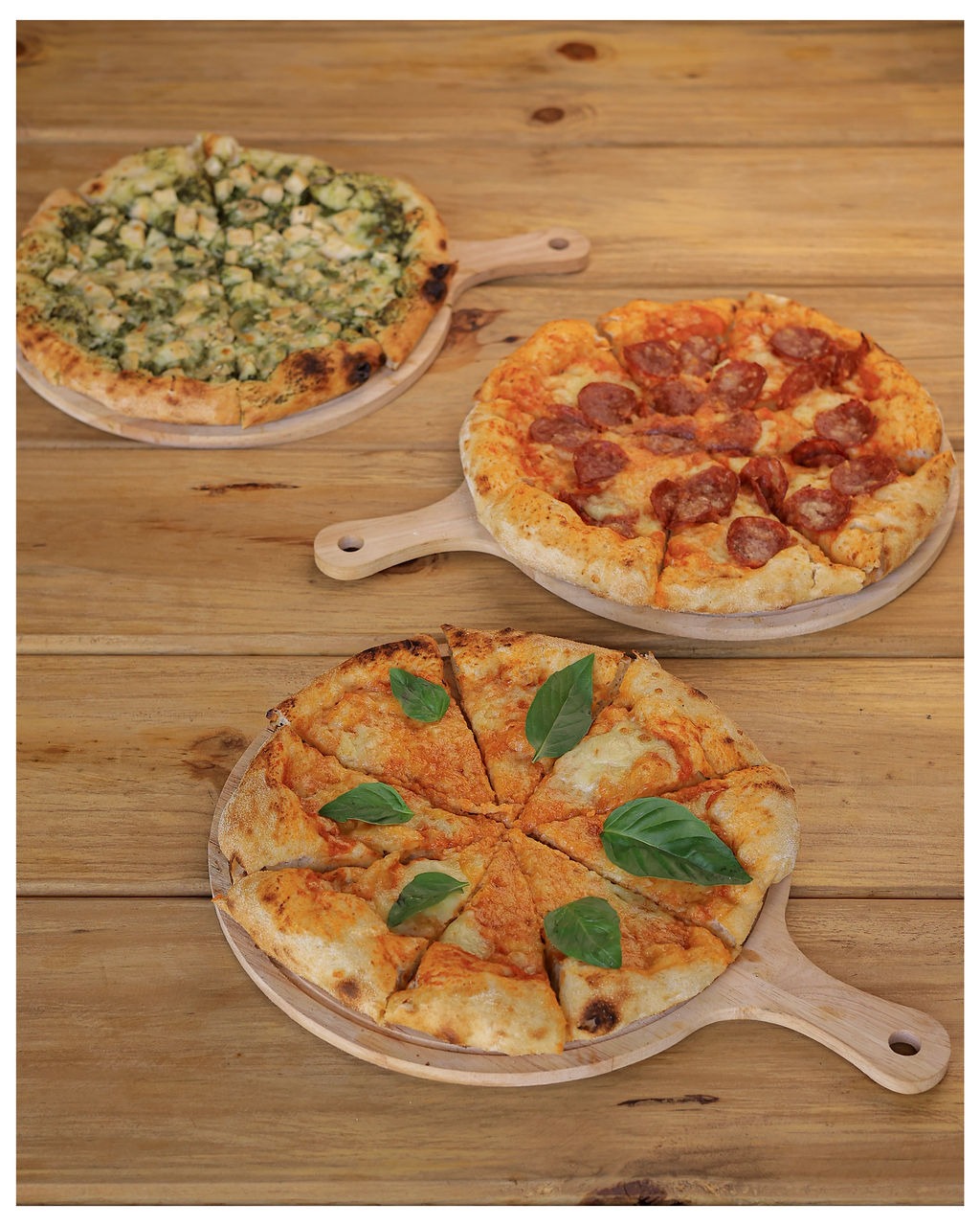Three finished Crust & Cone pizzas